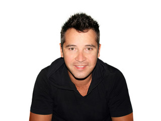 Full body portrait of a casual young man standing against white background