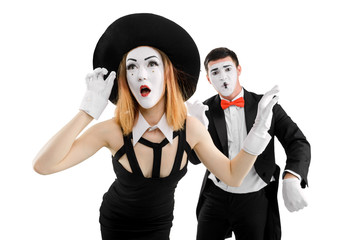 Female mime applying imaginary mascara