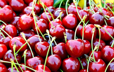 Many fresh cherry and Leaves with full frame.
Colorful of red fruit.