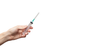 Femal hand holding syringe . Medical and science Concept. White background, isolated, close up