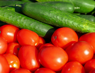 Tomatoes and cucumbers are sold at the fair in the fall