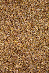 Small yellow stones on the road surface as background