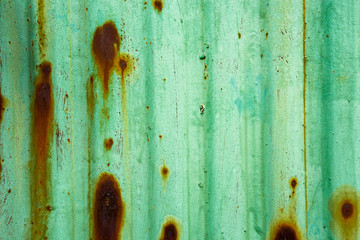 Green metal surface with corrosion