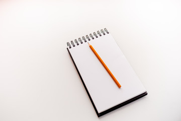 A sketchbook and a pencil