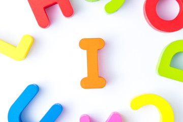 Naklejka premium I letters in English made from wood bright colors.