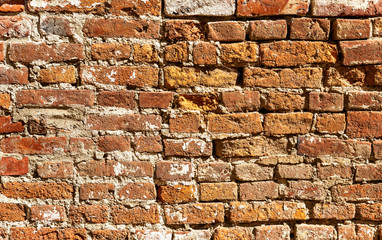Background of old weathered red brick wall
