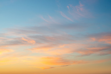 Beautiful vibrant sunset with thin clouds