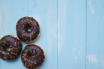 Baked chocolate doughnuts with chocolate glaze. toning. selective focus