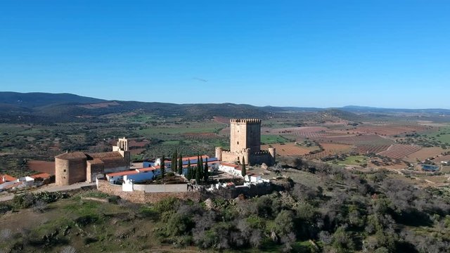 Village on a mountain, castle, white houses 
