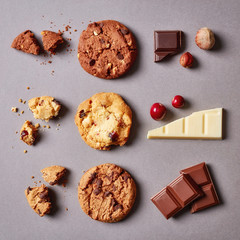 Fresh chocolate chip cookies pattern on grey background