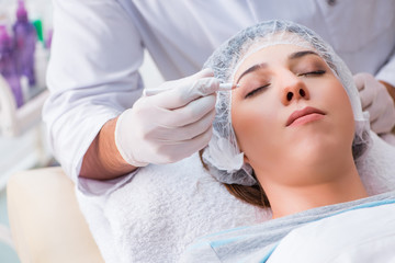 Woman visiting doctor cosmetologyst in beauty concept