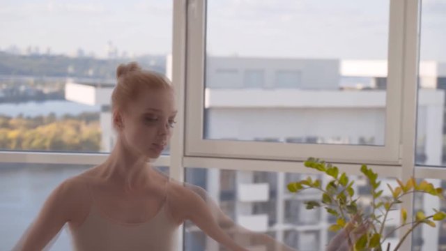 the young dancer diligently rehearses the choreography part. Difficult ballet weekdays. 4K