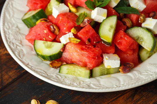 Healthy Watermelon, Cucumber Salad with Mint, pistachios nuts and feta cheese.