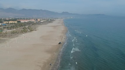 Tractor cleaning a beach