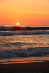 Sunset on a beach on the pacific ocean. Ecuador
