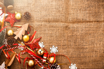 Fototapeta na wymiar festive celebration background with christmas decorating items on old vintage rattan floor with free copy space