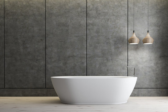 Concreter bathroom interior, white tub