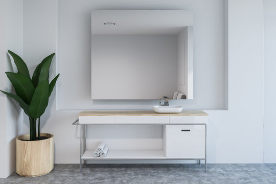 White bathroom interior, sink and mirror