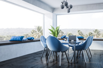 White dining room, blue chairs
