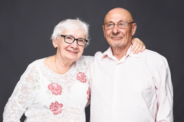 Portrait of senior elderly couple demonstrate their true love to each other, have good relationships, experienced many positive and negative events in life together, being inseparable and supportive.