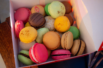 multicolored macaron cookies in a box
