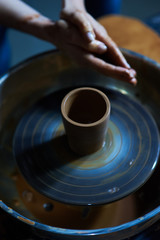 Master class on modeling of clay on a potter's wheel In the pottery workshop
