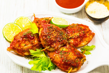 Stuffed Calamari Squid Tubes with Tomato Sauce. Selective focus.