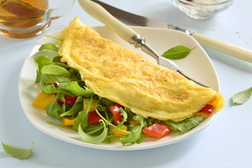 Omelet stuffed from arugula, sweet pepper