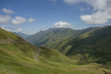 Serpentine road. Panorama of mountain valley from top of Datvisjvari  Pass, Georgia, Europe