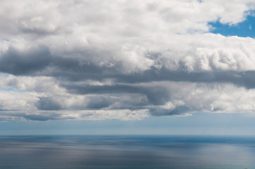 Fototapeta na wymiar white clouds and blue sea