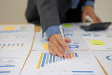 financial adviser use calculator to calculate revenue & budget. accountant doing accounting. bookkeeper making calculation