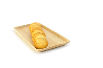 arrange cookie on wood plate in white background