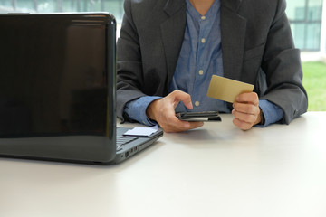 man holding credit card using smart phone for online shopping. businessman purchasing, make payment on internet