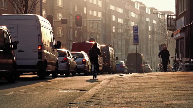 People And Cars In Sunny Downtown