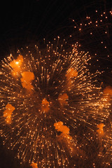 Texture of fireworks in the night sky. Bright lights in St. Petersburg. Red smoke and flashes