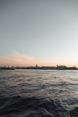 Elements of architecture of historical buildings. The streets of St. Petersburg with its bridges and rivers. Night view of the city at sunset.