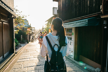 back view of beautiful lady walking on the street