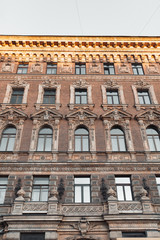 The formal architecture of St. Petersburg. The bridges and the river Neva embankment. Sunset over the city.