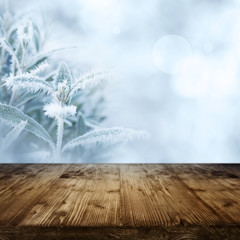 Ice flowers with wooden table in winter