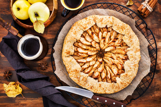 Apples and cinnamon rustic open pie (galette), top view
