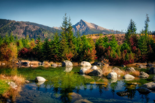 Beautiful autumn landscape with mountain peak and a lake, Krivan, Slovakia