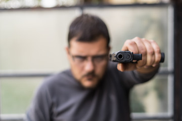 young man with a gun