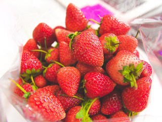 A fresh strawberries harvest from farm. A red fruit contains vitamins A for healthy.