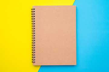 Blank empty notepad on yellow blue background - Business education stationery