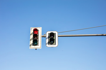 Red traffic lights for cars, blue sky background