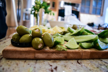 Cocktail and bloody mary ingredients on a cutting board