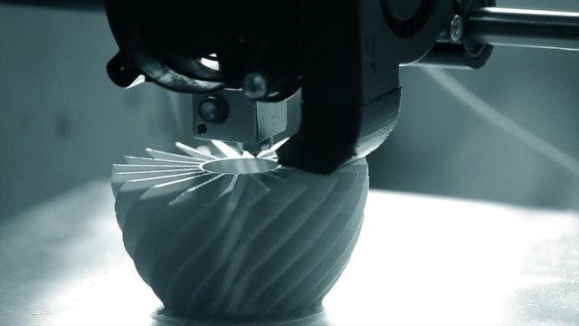 3D printer working close up. Automatic three dimensional 3d printer performs plastic. Modern 3D printer printing an object from the hot molten. Concept progressive additive technology for 3d printing.