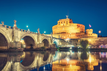 View on Castel St. Angelo in Rome, Italy, at night. Scenic travel background.