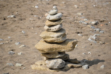 stack of stones on the beach - 228878735
