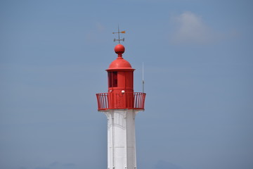 lighthouse on background of blue sky - 228878746
